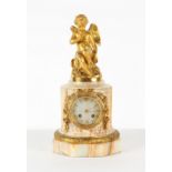 Property of a lady - a late 19th century French ormolu mounted onyx mantel clock, surmounted by a