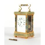 The Henry & Tricia Byrom Collection - a gilt brass, green onyx & champleve enamel carriage clock,