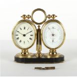 The Henry & Tricia Byrom Collection - a brass twin oval cased desk clock & barometer, with