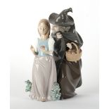 Property of a deceased estate - a Lladro figure of Snow White & The Witch, 10.5ins. (26.5cms.) high.