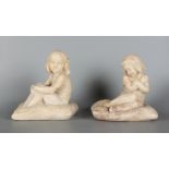 Property of a lady - a pair of early 20th century carved alabaster figures of girls seated on