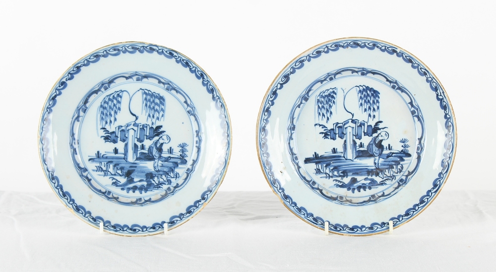 Property of a gentleman - a pair of mid 18th century Delft blue & white shallow dishes, with painted