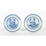 Property of a gentleman - a pair of mid 18th century Delft blue & white shallow dishes, with painted