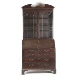 Property of a lady of title - a George III mahogany bureau bookcase, 45.7ins. (116cms.) wide (