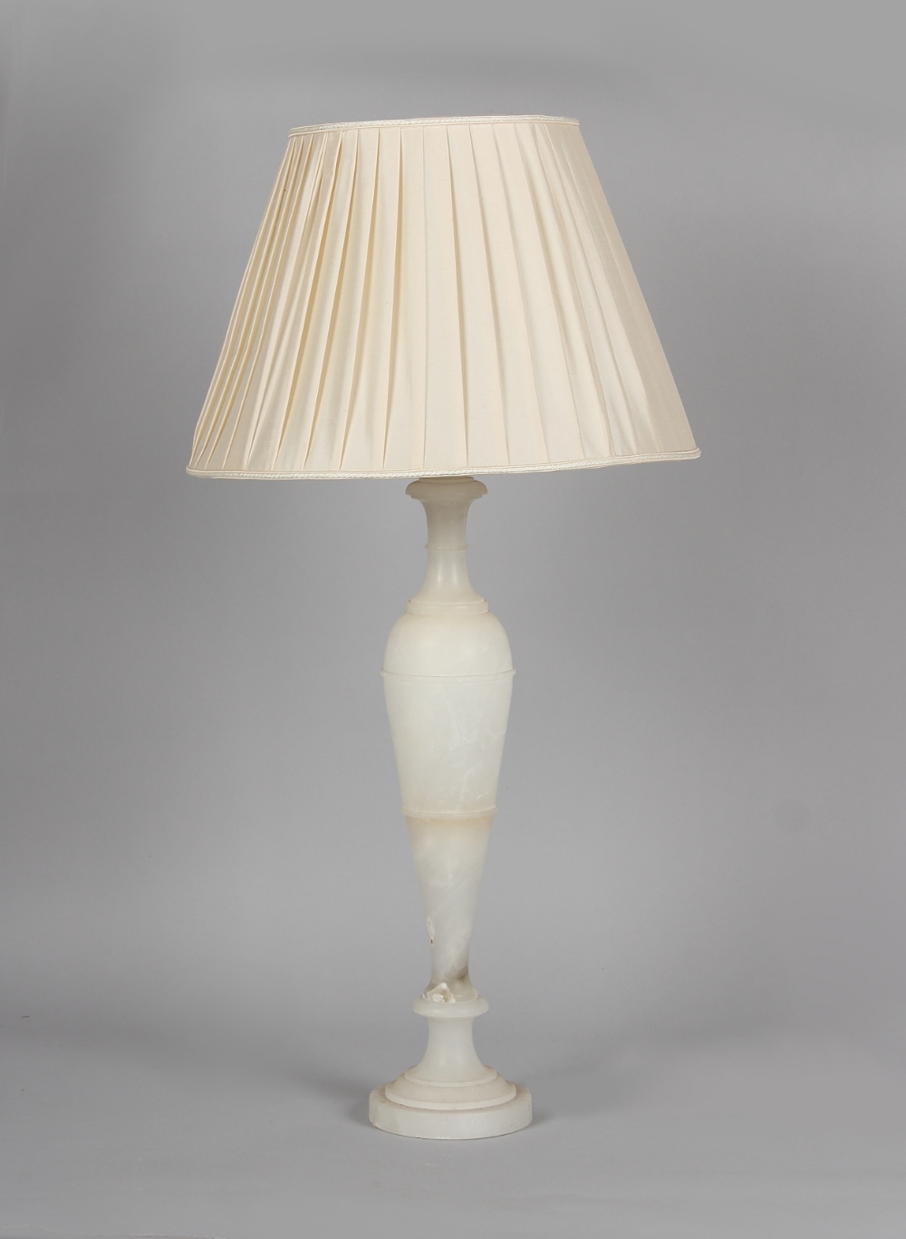 Property of a gentleman - a large white alabaster table lamp, with shade, 30.25ins. (92cms.) high (