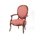 Property of a lady of title - a 19th century rosewood & later red upholstered armchair, with