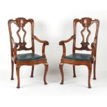 Property of a gentleman - a pair of early 20th century carved oak elbow chairs (2).