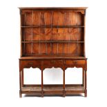 A solid yew wood two part Welsh dresser, 20th century, 62ins. (157.5cms.) wide (overall).