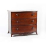 Property of a lady - an early 19th century mahogany bow-fronted chest of three long graduated