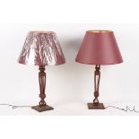 Property of a deceased estate - a large pair of carved walnut table lamps, of square reticulated