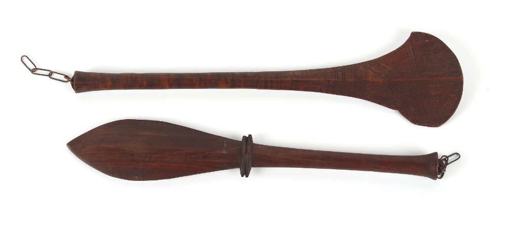 Property of a lady - ethnographia - two tribal carved wood war clubs, one of fan form, probably