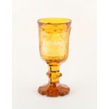 Property of a gentleman - a 19th century Bohemian amber flashed glass goblet with engraved panel