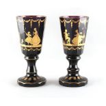 Property of a gentleman - a pair of 19th century Bohemian gilt decorated amethyst glass goblets,