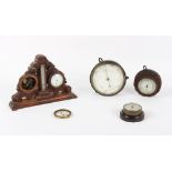 Property of a deceased estate - a group of four aneroid barometers, the carved oak desk