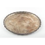 Property of a lady of title - an unmarked white metal (tests silver) circular tray or waiter,