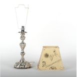 Property of a lady of title - an Edwardian silver rococo candlestick, adapted as a table lamp,