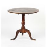 Property of a lady - a George III oak circular tilt-top tripod table, 29ins. (74cms.)