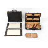 Property of a gentleman - two black leather attache cases; together with two black leather desk