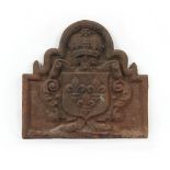 Property of a gentleman - an antique cast iron fire back, approximately 23 by 24ins. (58.5 by