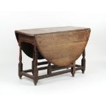 Property of a lady - a late 17th / early 18th century oak oval topped gate-leg dining table, with