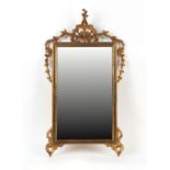 Property of a deceased estate - a carved giltwood framed wall mirror, probably early 20th century,