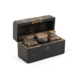 Property of a deceased estate - a 19th century black leather cased set of three silver topped cut