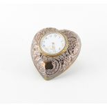 Property of a deceased estate - an Edwardian ornate silver heart shaped easel travel clock,