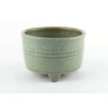 A Chinese Longquan celadon glazed tripod censer, Ming Dynasty, 16th / 17th century, decorated with a