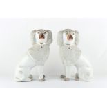 Property of a gentleman - a pair of Victorian Staffordshire models of poodles, each approximately