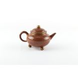 A Chinese Yixing teapot with mottled decoration, seal mark to inside of lid and to base, 6ins. (15.