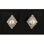 A pair of 18ct white gold pearl & diamond lozenge shaped earrings, with clip fastenings, each with a