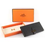 Property of a lady of title - in the manner of Hermes - a black leather card wallet, 7.5ins. (19cms.