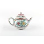 An 18th century Chinese Qianlong period famille rose chrysanthemum moulded teapot & cover, with pink