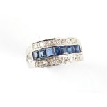 An unmarked white gold sapphire & diamond three row ring, with a row of seven rectangular cut