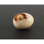 The Henry & Tricia Byrom Collection - a Japanese carved ivory okimono modelled as a chick hatching
