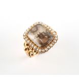 A large early 19th century yellow gold mourning ring, the rounded rectangular panel with hair