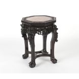 Property of a lady - a Chinese carved hardwood octagonal plant stand, with marble inset top, 18.