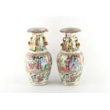 A pair of 19th century Chinese Canton famille rose baluster vases, 9ins. (23cms.) high (2).