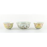 A pair of Chinese yellow ground famille rose 'Birthday' pattern bowls, iron red Guangxu 6-