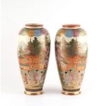 A pair of Japanese Satsuma vases, early 20th century, indistinct signature panels to base, each