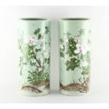 Property of a lady - a pair of celadon ground porcelain sleeve vases, Japanese or possibly Korean,