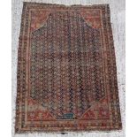 Property from the estate of the late Julian Bream (1933-2020) - an antique Senneh rug, with dated