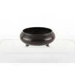 A Chinese bronze shallow tripod censer, 18th / 19th century, with foliate border, Xuande 6-character