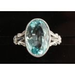 An 18ct white gold aquamarine ring, the oval cut aquamarine weighing an estimated 5.60 carats, in