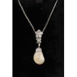 A very large natural saltwater pearl & diamond pendant necklace, the cream coloured pearl