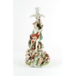 Property of a gentleman - a Derby patch mark period porcelain Neptune figural candlestick, circa