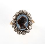 A 19th century unmarked yellow gold diamond & hardstone oval cameo ring, carved with a blackamoor or