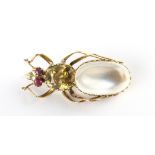 A large moonstone chrysolite & ruby insect brooch, 37mm long.