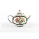 An 18th century Chinese Qianlong period famille rose chrysanthemum moulded teapot & a cover, with