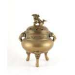 A 19th century Chinese bronze tripod censer, Xuande seal mark to base, 5.5ins. (14cms.) high.